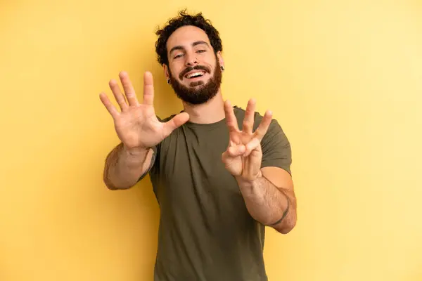 Young Adult Bearded Man Smiling Looking Friendly Showing Number Eight — Stock Photo, Image