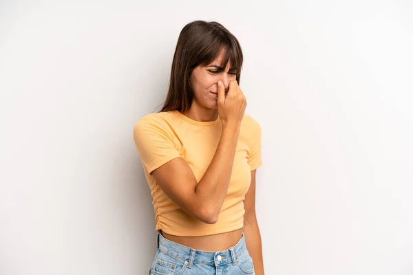 Hispanic Pretty Woman Feeling Disgusted Holding Nose Avoid Smelling Foul — Stock Photo, Image