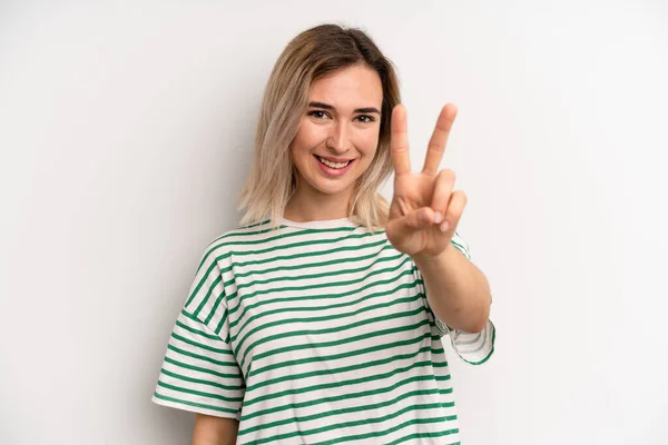 Young Adult Blonde Woman Smiling Looking Happy Carefree Positive Gesturing – stockfoto