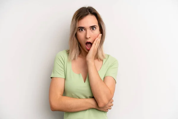 Young Adult Blonde Woman Open Mouthed Shock Disbelief Hand Cheek — Foto de Stock