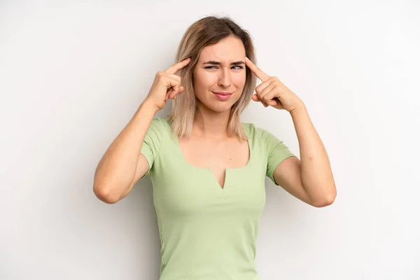 Young Adult Blonde Woman Looking Concentrated Thinking Hard Idea Imagining — Stockfoto