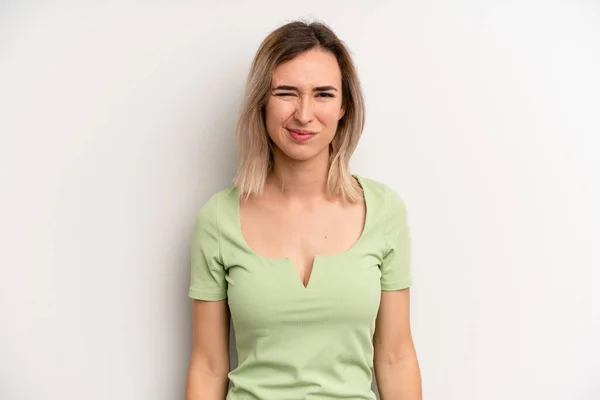Young Adult Blonde Woman Looking Puzzled Confused Biting Lip Nervous — ストック写真