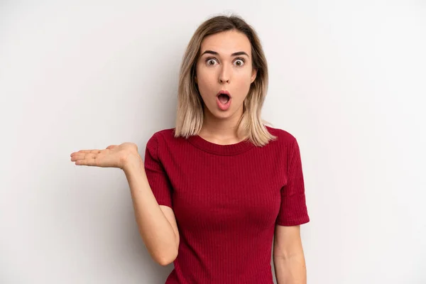 Young Adult Blonde Woman Looking Surprised Shocked Jaw Dropped Holding — Foto Stock