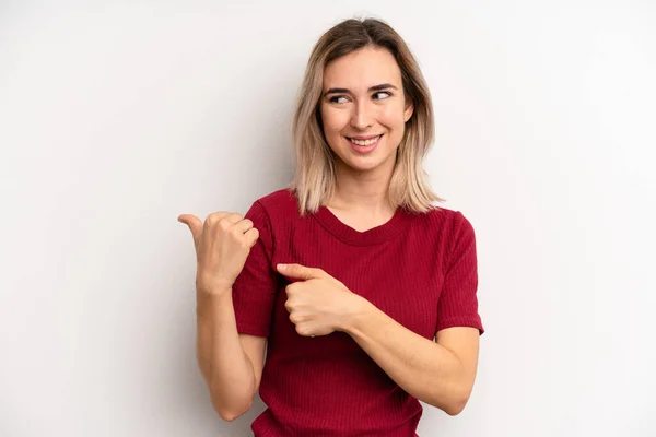 Young Adult Blonde Woman Smiling Cheerfully Casually Pointing Copy Space — Stok fotoğraf