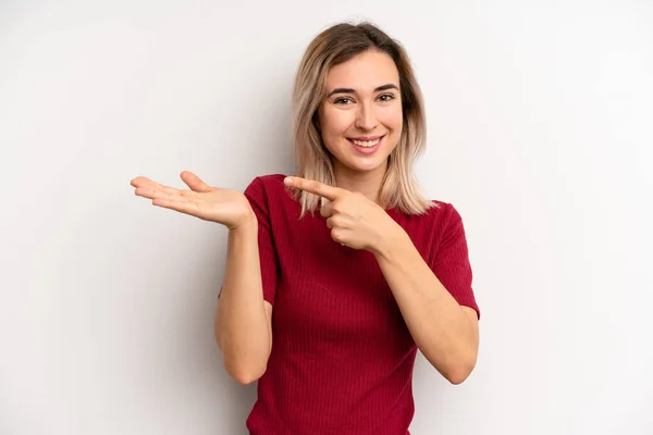 Young Adult Blonde Woman Smiling Cheerfully Pointing Copy Space Palm — ストック写真
