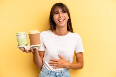 laughing out loud at some hilarious joke. take away coffees