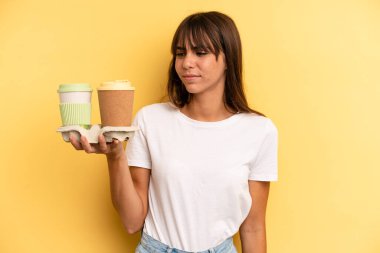 on profile view thinking, imagining or daydreaming. take away coffees