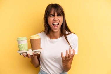 looking desperate, frustrated and stressed. take away coffees