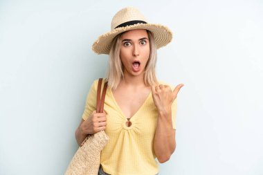blonde woman looking astonished in disbelief. summer concept