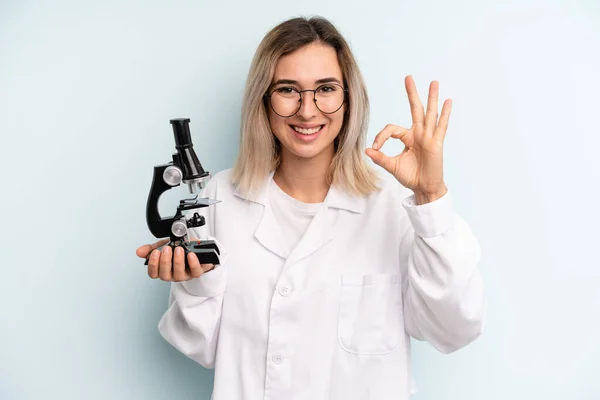 Blonde Woman Feeling Happy Showing Approval Okay Gesture Scientist Student — Stockfoto