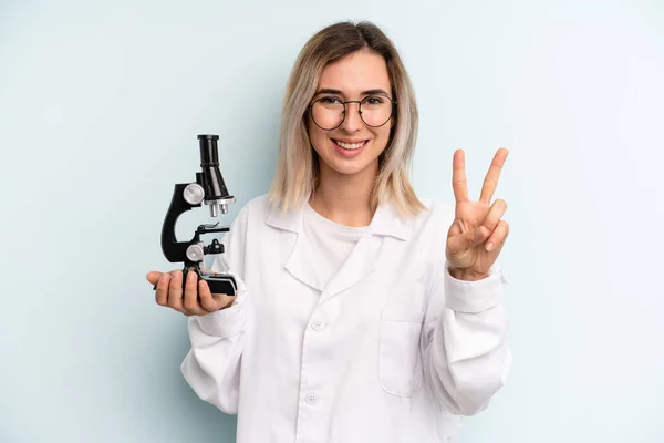 Blonde Woman Smiling Looking Friendly Showing Number Two Scientist Student — Foto Stock