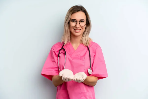 Blonde Woman Smiling Happily Friendly Offering Showing Concept Nurse Concept — Stockfoto