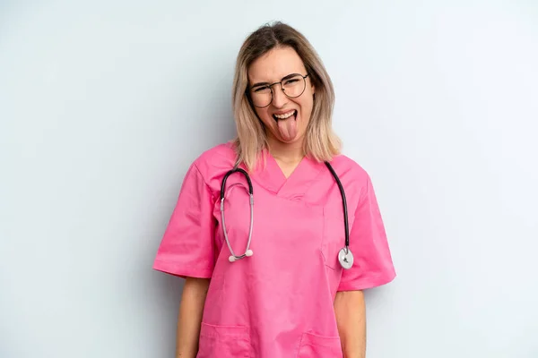 Blonde Woman Cheerful Rebellious Attitude Joking Sticking Tongue Out Nurse — Zdjęcie stockowe