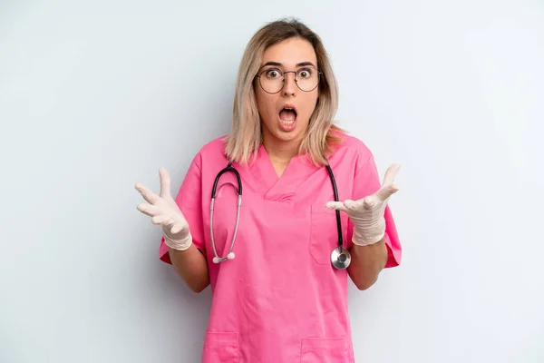 Blonde Woman Amazed Shocked Astonished Unbelievable Surprise Nurse Concept — Zdjęcie stockowe