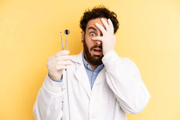 Young Man Looking Shocked Scared Terrified Covering Face Hand Dentist — Stock Photo, Image