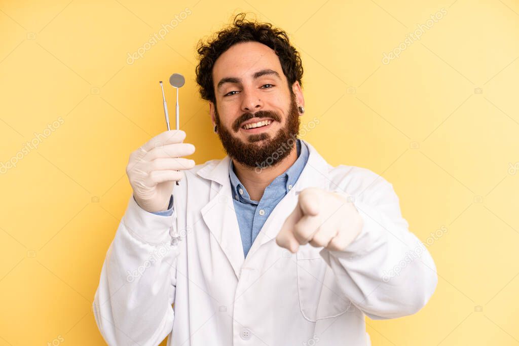 young man pointing at camera choosing you. dentist concept