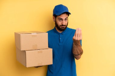 Genç adam kapiş ya da para hareketi yapıyor, sana ödemeni söylüyor. Şirket çalışanı konsepti