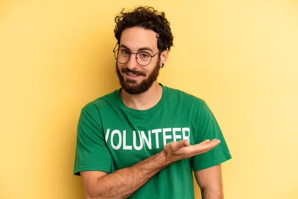 Young Man Smiling Cheerfully Feeling Happy Showing Concept Volunteer Concept — Stock Photo, Image