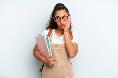 hispanic woman feeling bored, frustrated and sleepy after a tiresome. university student concept
