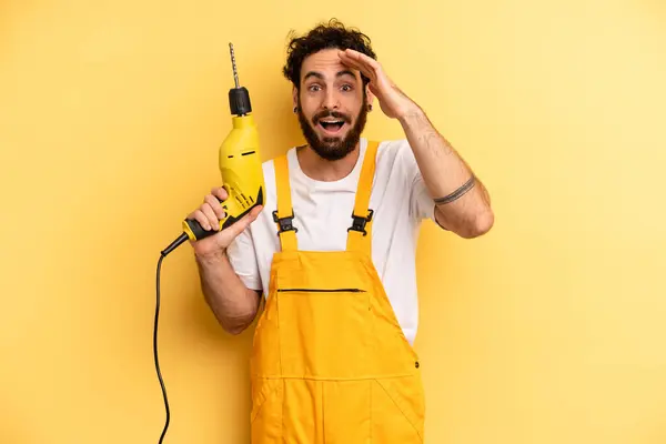 Young Man Looking Happy Astonished Surprised Handyman Drill — Stock Photo, Image