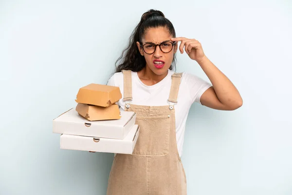 Hispanic Woman Feeling Confused Puzzled Showing You Insane Fast Food — Stockfoto