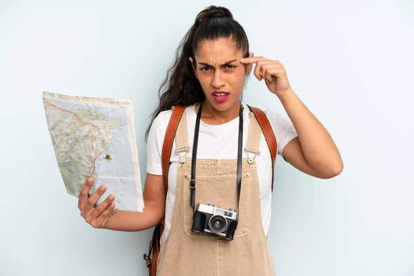 Hispanic Woman Feeling Confused Puzzled Showing You Insane Tourist Map — Fotografia de Stock