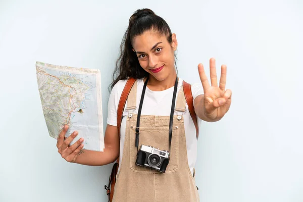 Hispanic Woman Smiling Looking Friendly Showing Number Three Tourist Map — Fotografia de Stock