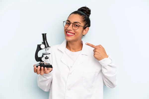 Hispanic Woman Smiling Confidently Pointing Own Broad Smile Scients Student — Fotografia de Stock