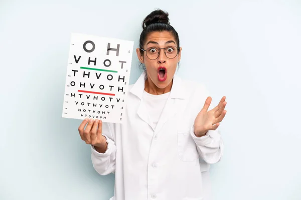 Hispanic Woman Feeling Extremely Shocked Surprised Optical Vision Test Concept — Stock Photo, Image