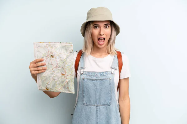 Blonde Woman Looking Very Shocked Surprised Tourist Map Concept — Zdjęcie stockowe