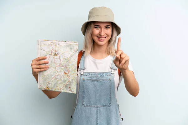 Blonde Woman Smiling Proudly Confidently Making Number One Tourist Map — Zdjęcie stockowe