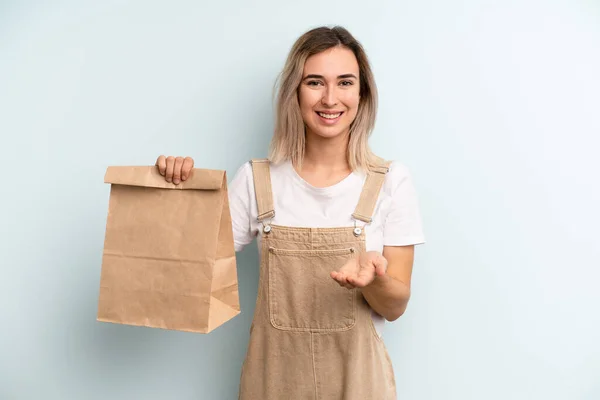 Blonde Woman Smiling Happily Friendly Offering Showing Concept Take Away — ストック写真