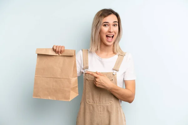 Blonde Woman Looking Excited Surprised Pointing Side Take Away Delivery — ストック写真