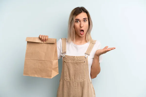 Blonde Woman Looking Surprised Shocked Jaw Dropped Holding Object Take — ストック写真