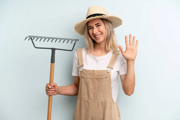 Blonde Woman Smiling Happily Waving Hand Welcoming Greeting You Farmer — Stockfoto