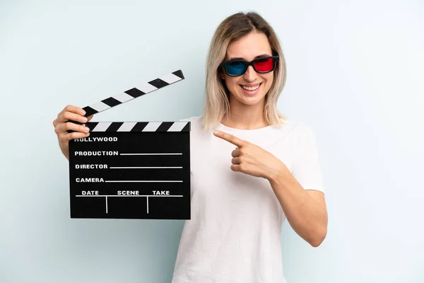 Blonde Woman Looking Excited Surprised Pointing Side Film Movie Concept — Stok fotoğraf