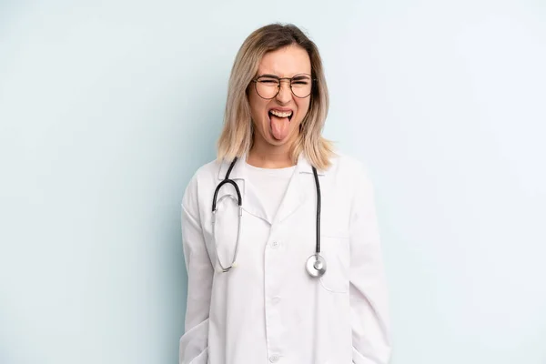 Blonde Woman Cheerful Rebellious Attitude Joking Sticking Tongue Out Medicine — Stockfoto