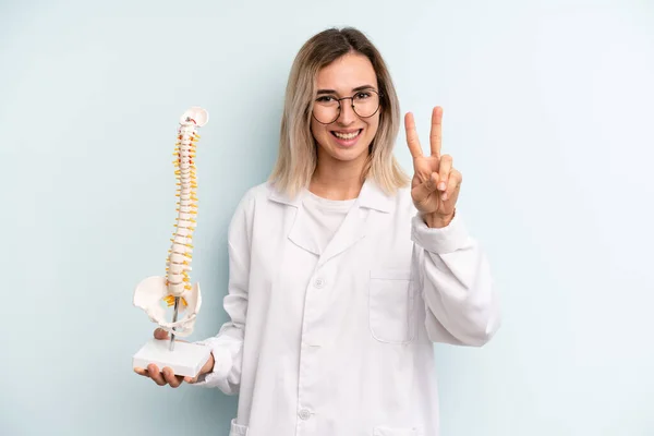 Blonde Woman Smiling Looking Happy Gesturing Victory Peace Medicine Student — Stockfoto