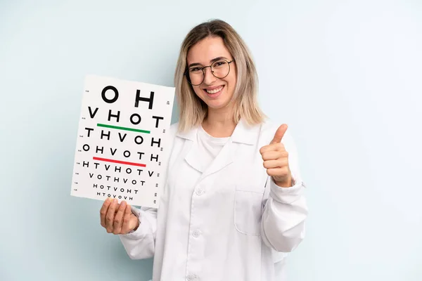Blonde Woman Feeling Proud Smiling Positively Thumbs Optical Vision Test — Stockfoto
