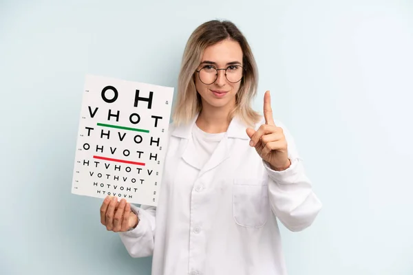 Blonde Woman Smiling Proudly Confidently Making Number One Optical Vision — Stockfoto