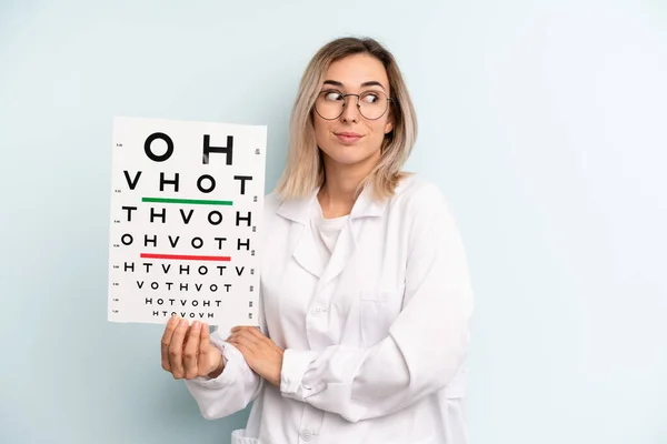 Blonde Woman Shrugging Feeling Confused Uncertain Optical Vision Test Concept — Stockfoto