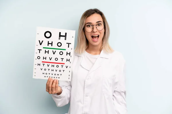 Blonde Woman Looking Happy Pleasantly Surprised Optical Vision Test Concept — Stockfoto