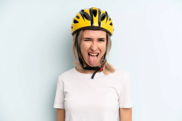 Blonde Woman Cheerful Rebellious Attitude Joking Sticking Tongue Out Bike — Zdjęcie stockowe