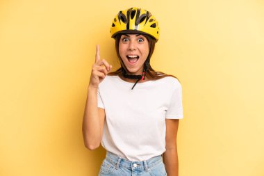 pretty woman feeling like a happy and excited genius after realizing an idea. bike sport concept