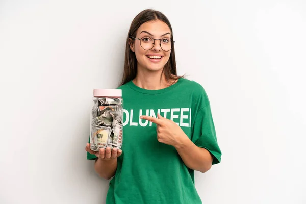 Pretty Woman Looking Excited Surprised Pointing Side Volunteer Donation Concept — Stockfoto