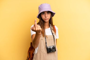 pretty woman feeling angry, annoyed, rebellious and aggressive. tourist photographer concept