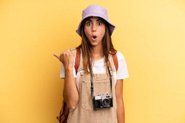 pretty woman looking astonished in disbelief. tourist photographer concept