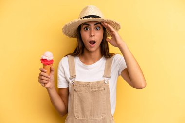 pretty woman looking happy, astonished and surprised. ice cream and summer concept