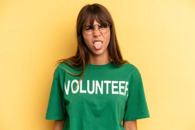 pretty woman feeling disgusted and irritated and tongue out. volunteer and donation concept