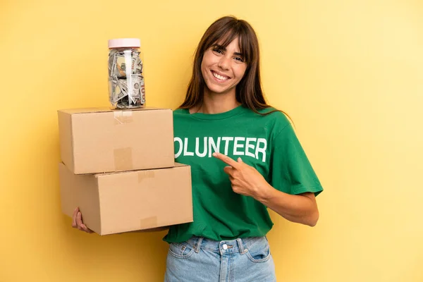 Pretty Woman Smiling Cheerfully Feeling Happy Pointing Side Volunteer Donation — Stok Foto